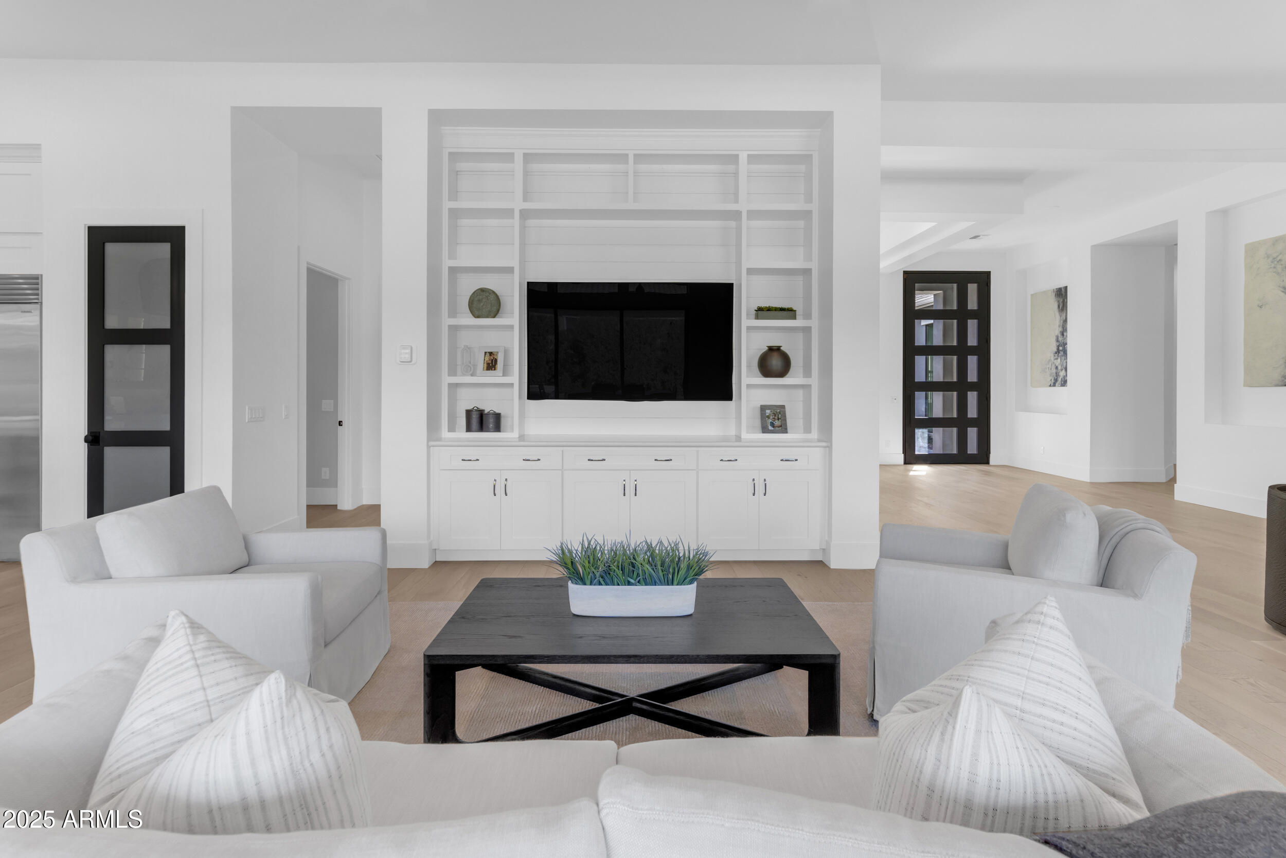 2580 East Country Shadows Street Gilbert, AZ 85298 - Photo 11 of 94 a living room with furniture a fireplace and a flat screen tv