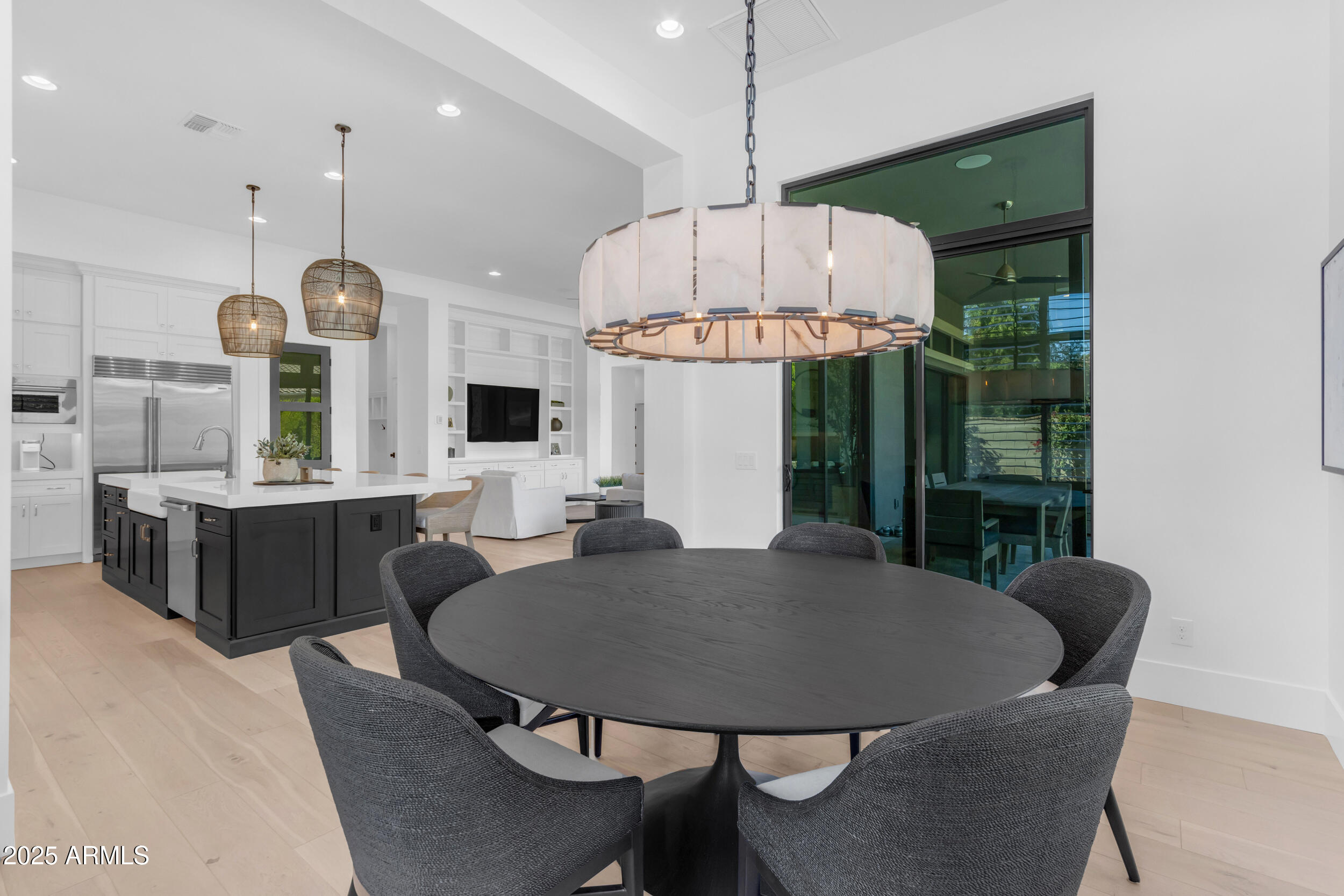 2580 East Country Shadows Street Gilbert, AZ 85298 - Photo 27 of 94 a view of a dining room with furniture window and wooden floor