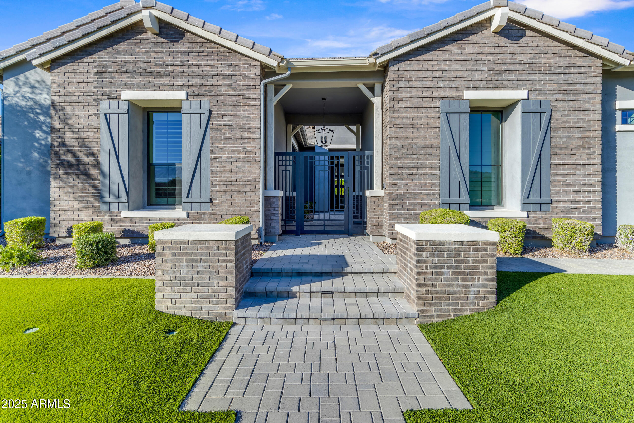 2580 East Country Shadows Street Gilbert, AZ 85298 - Photo 3 of 94 a front view of a house with a yard