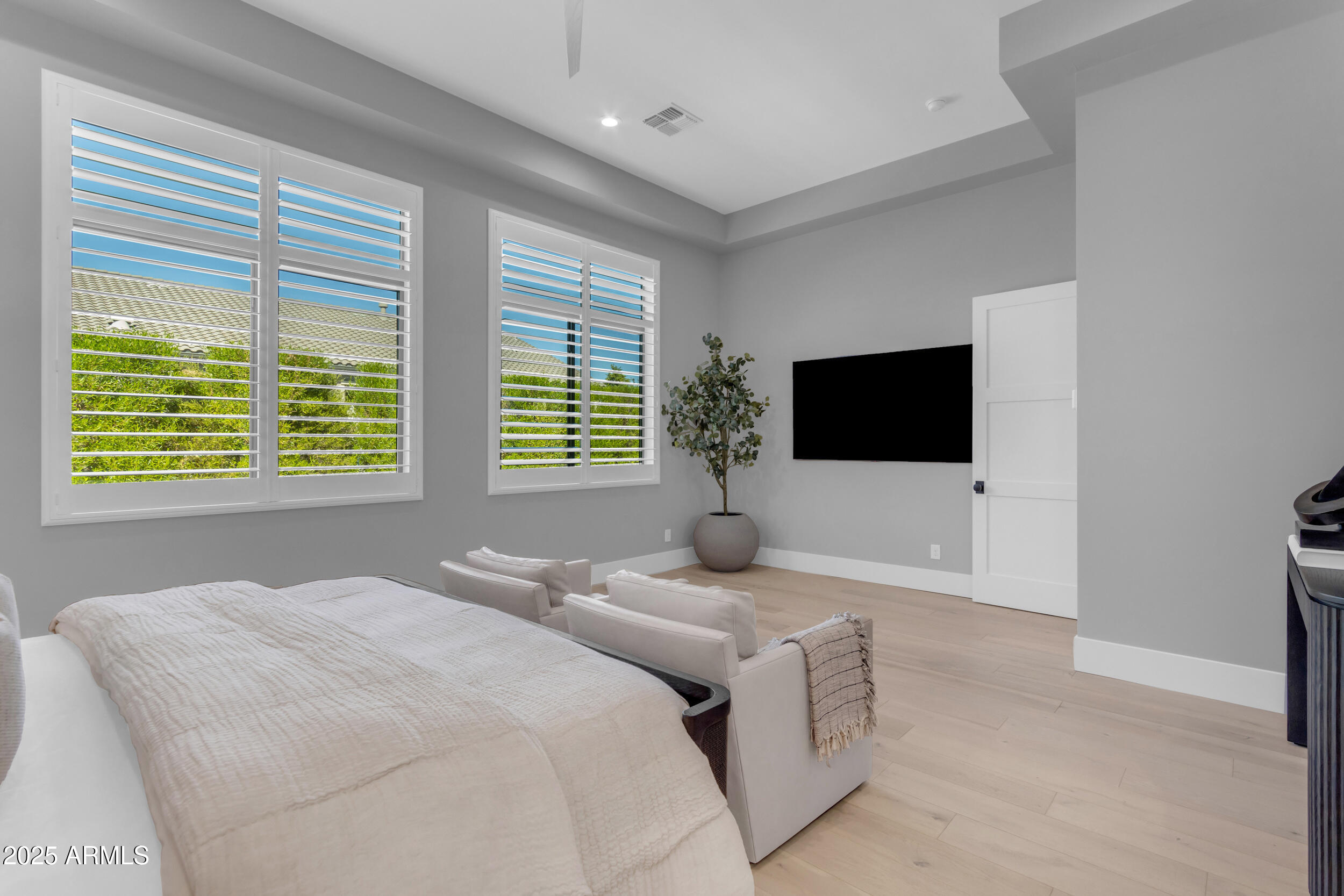 2580 East Country Shadows Street Gilbert, AZ 85298 - Photo 33 of 94 a bedroom with a bed and a flat screen tv