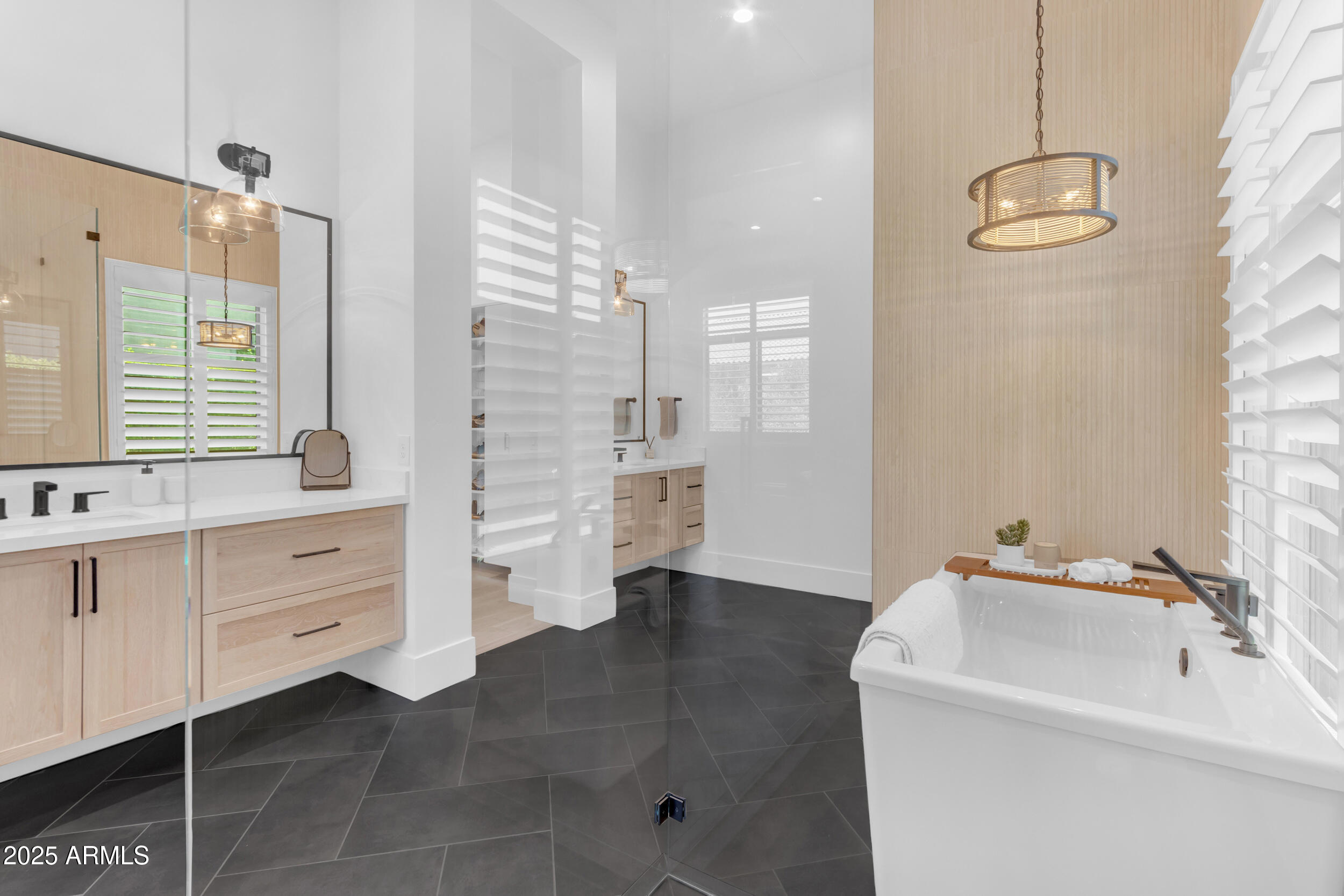 2580 East Country Shadows Street Gilbert, AZ 85298 - Photo 36 of 94 a bathroom with a double vanity sink a mirror and a bathtub