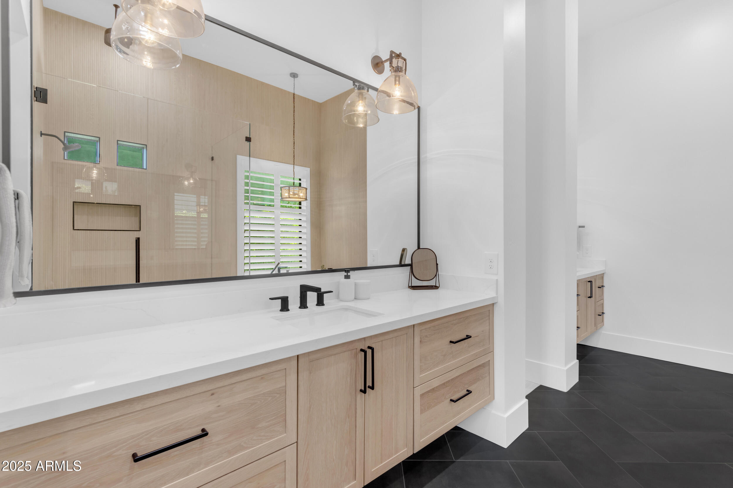 2580 East Country Shadows Street Gilbert, AZ 85298 - Photo 39 of 94 a bathroom with a double vanity sink a mirror and a shower