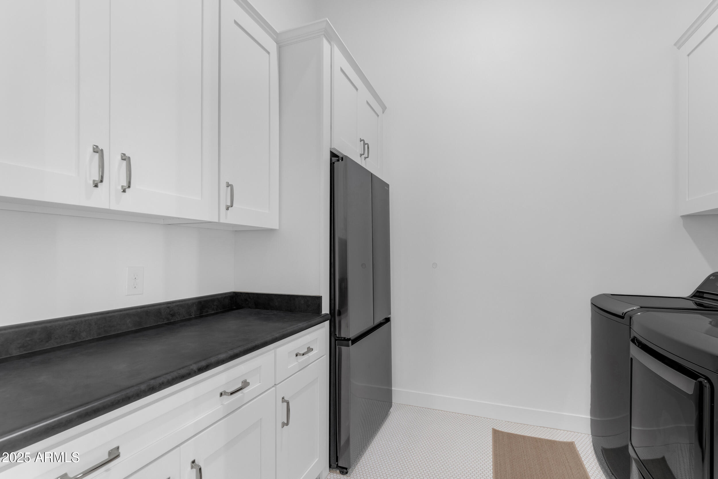 2580 East Country Shadows Street Gilbert, AZ 85298 - Photo 49 of 94 a kitchen with granite countertop white cabinets and a stove