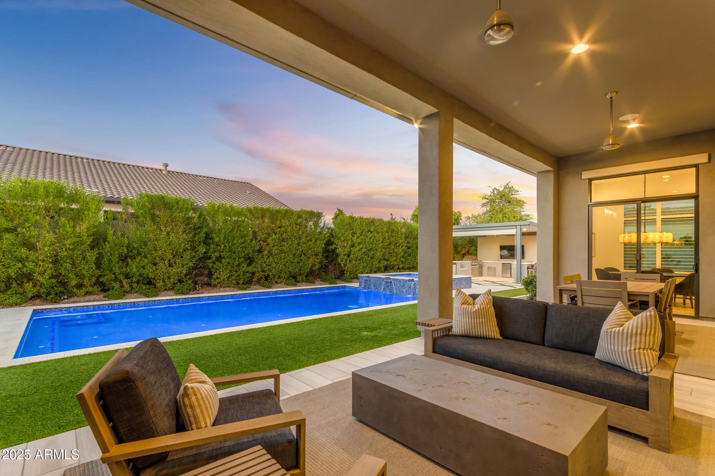 2580 East Country Shadows Street Gilbert, AZ 85298 - Photo 76 of 94 a living room with furniture and a floor to ceiling window