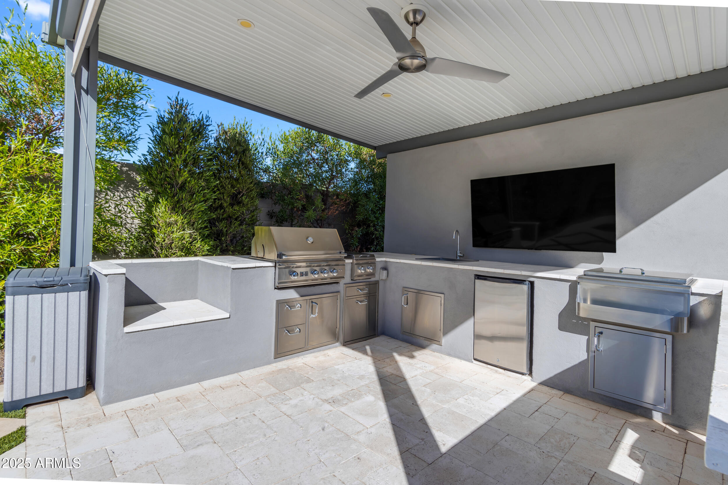 2580 East Country Shadows Street Gilbert, AZ 85298 - Photo 84 of 94 a room with furniture a flat screen tv and a floor to ceiling window
