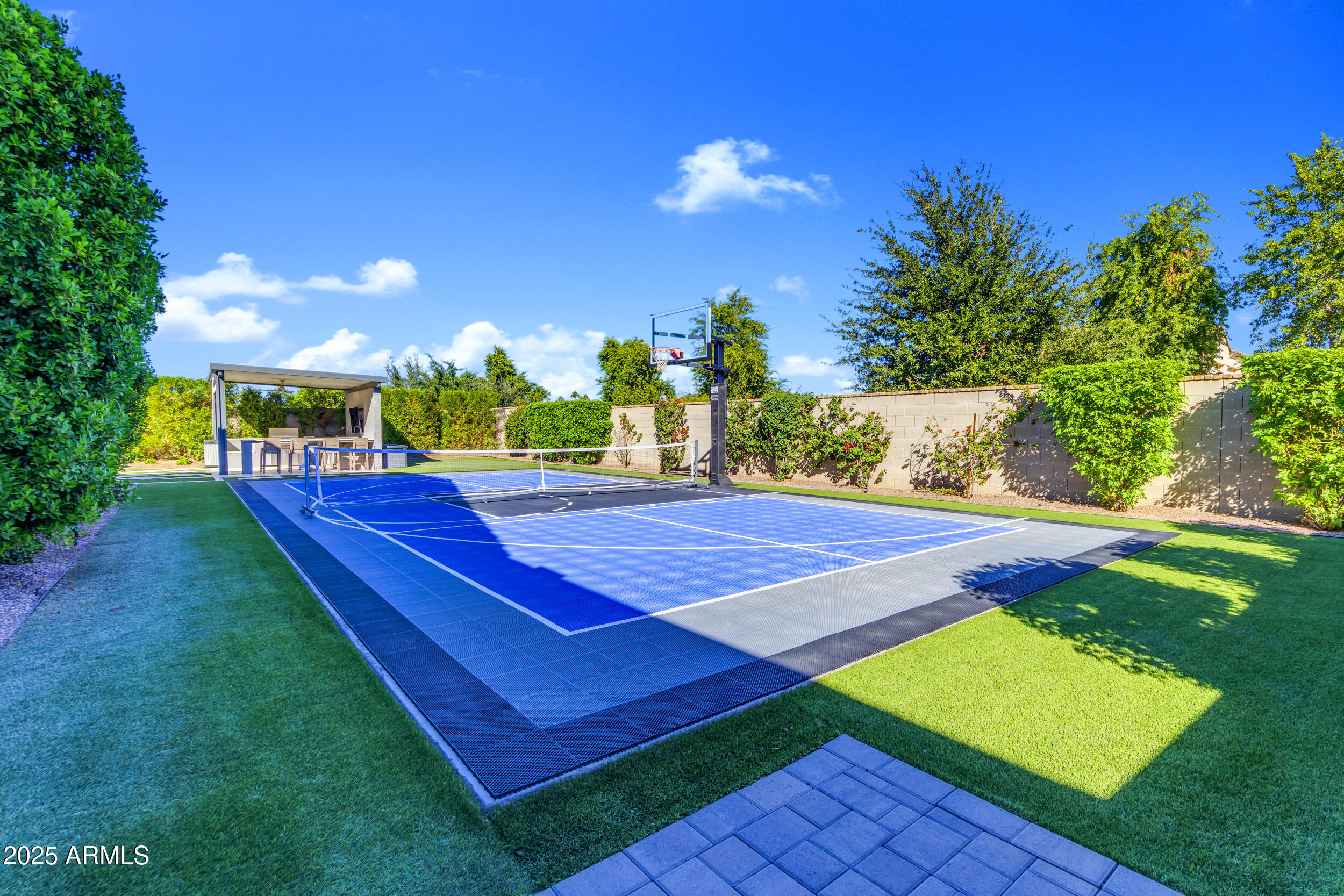 2580 East Country Shadows Street Gilbert, AZ 85298 - Photo 89 of 94 a view of a tennis ground with large trees