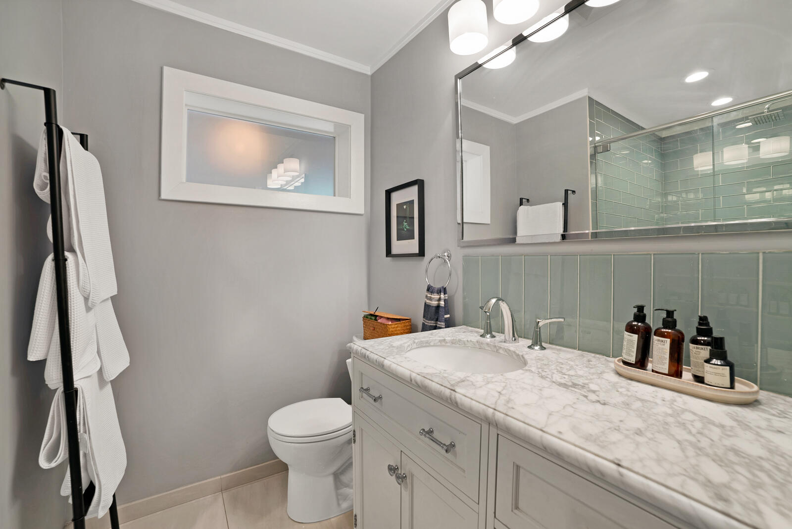 1322 George Street Key West, FL 33040 - Photo 35 of 52 a bathroom with a granite countertop toilet sink and a mirror