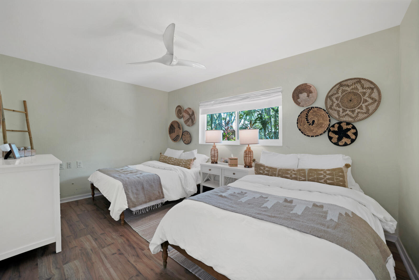 1322 George Street Key West, FL 33040 - Photo 39 of 52 a bedroom with two beds and a chandelier
