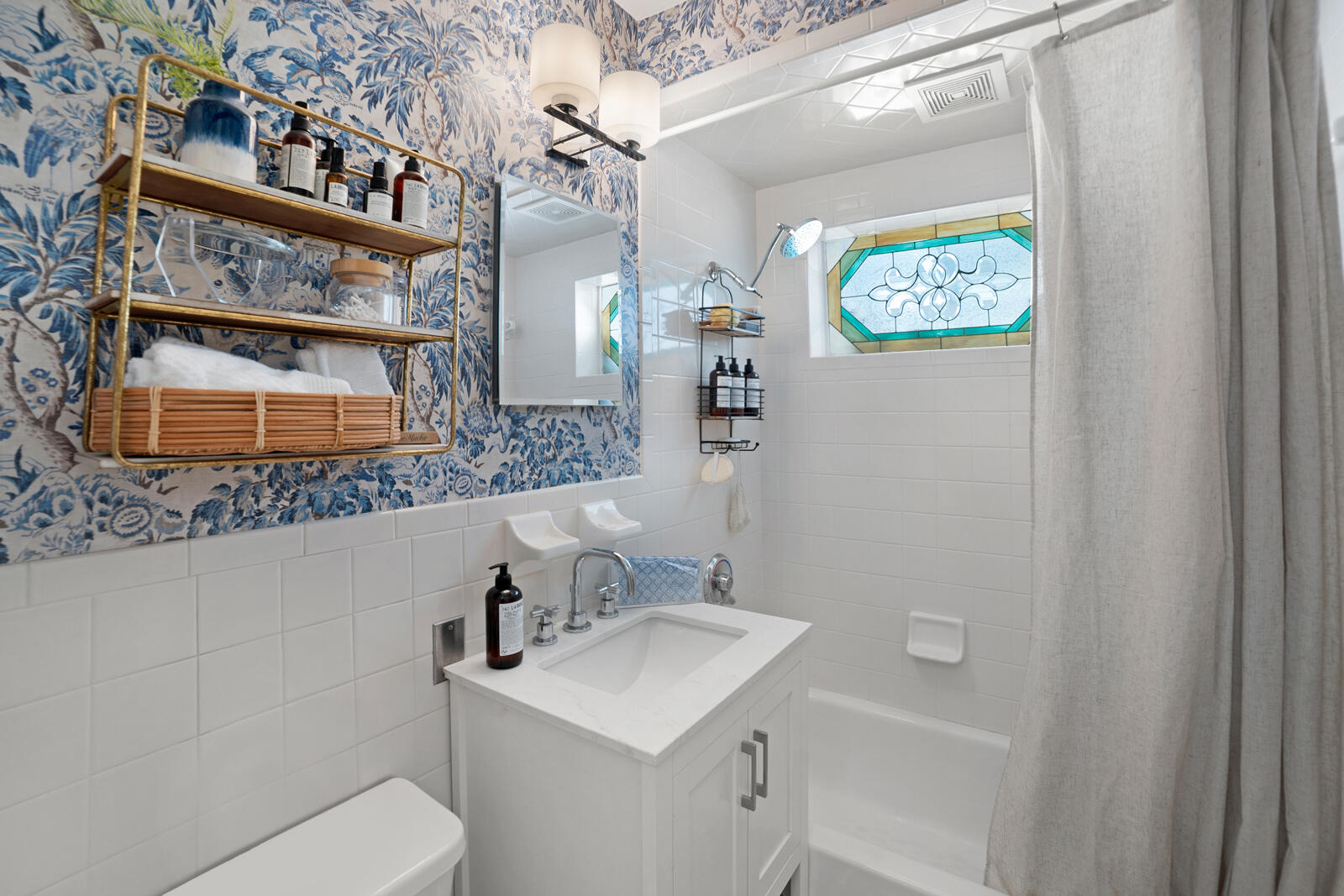 1322 George Street Key West, FL 33040 - Photo 41 of 52 a bathroom with a toilet sink and mirror