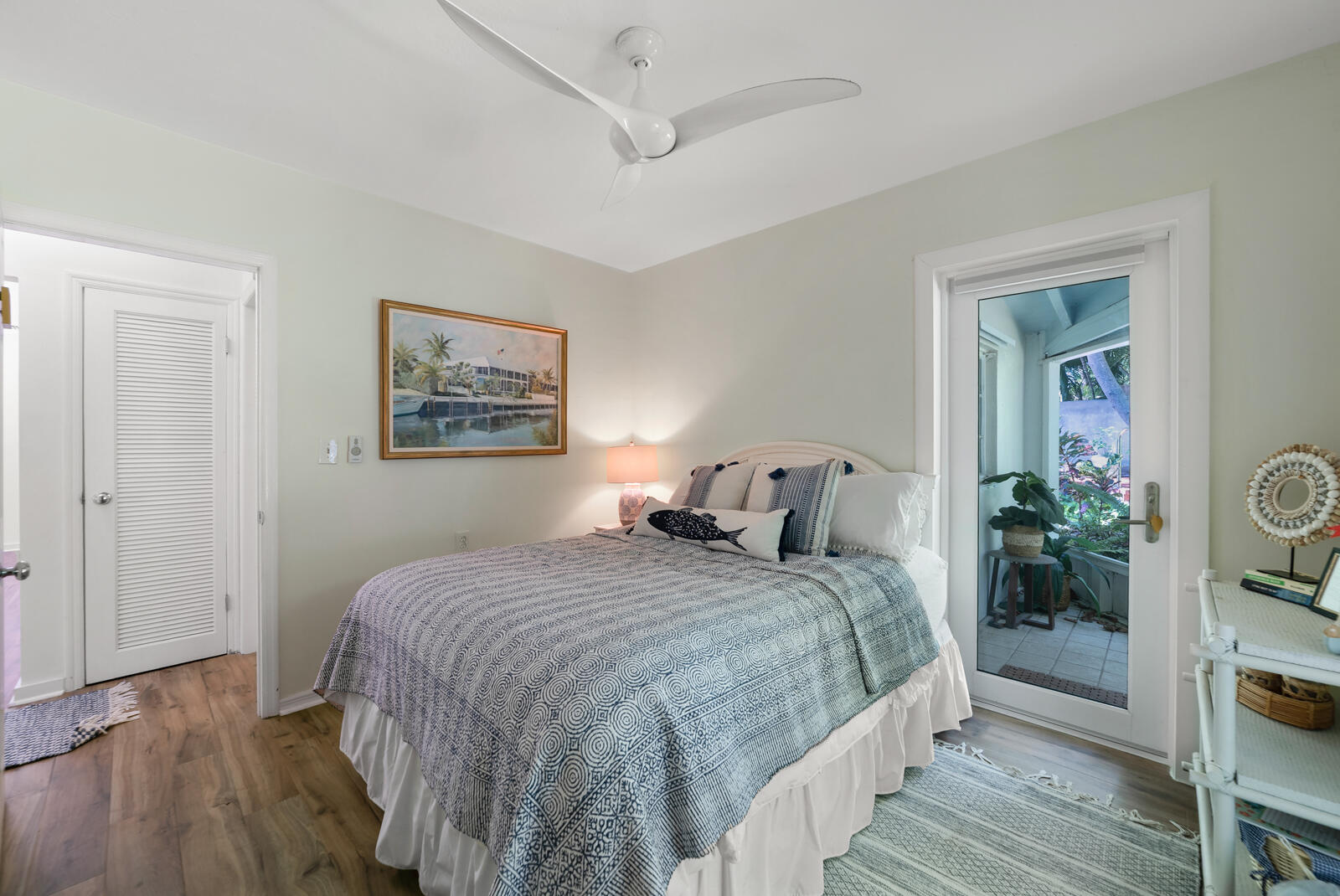 1322 George Street Key West, FL 33040 - Photo 43 of 52 a bedroom with a large bed and a painting on the wall