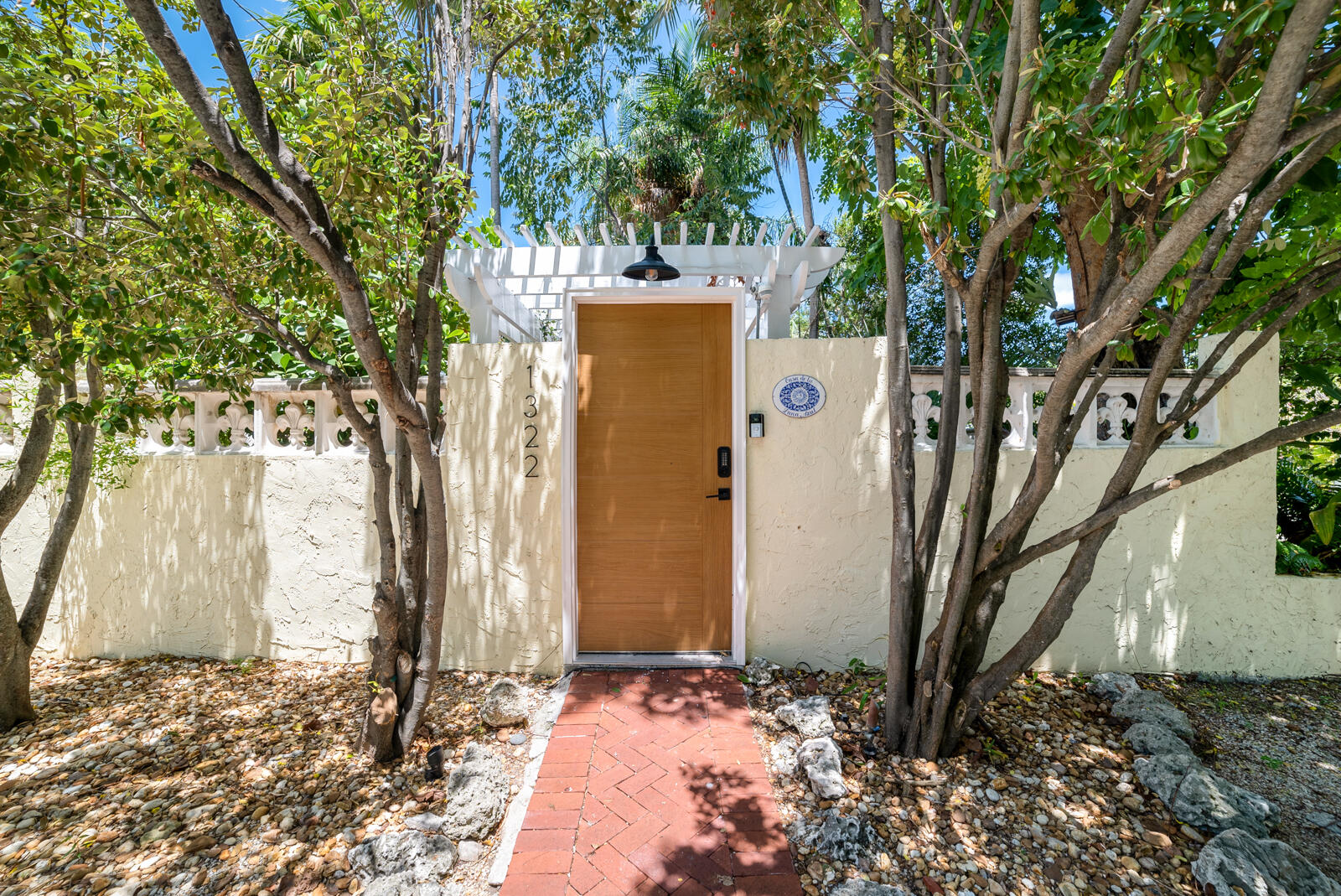 1322 George Street Key West, FL 33040 - Photo 46 of 52 a view of a house with a tree in the yard
