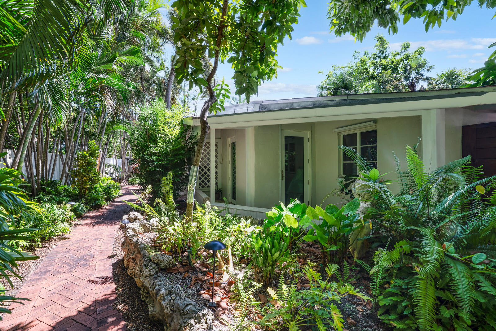 1322 George Street Key West, FL 33040 - Photo 47 of 52 front view of a house with a garden