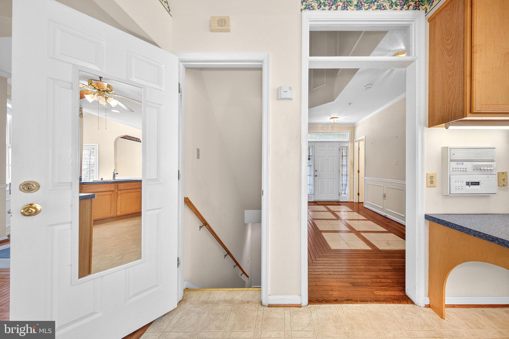6008 Plata Street Clinton, MD 20735 - Photo 11 of 55 a view of an entryway with wooden floor and a livingroom