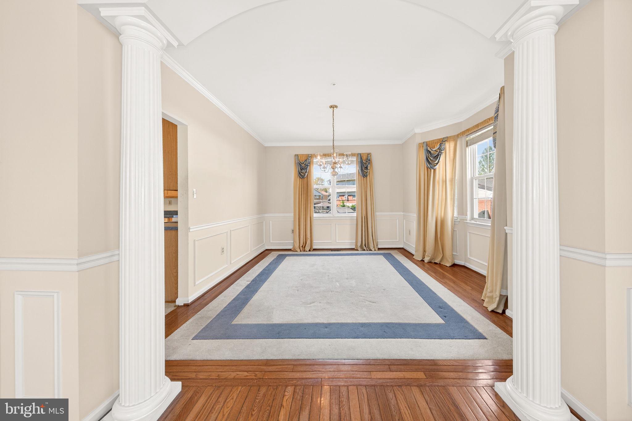 6008 Plata Street Clinton, MD 20735 - Photo 13 of 55 a view of a hallway with wooden floor and cabinet