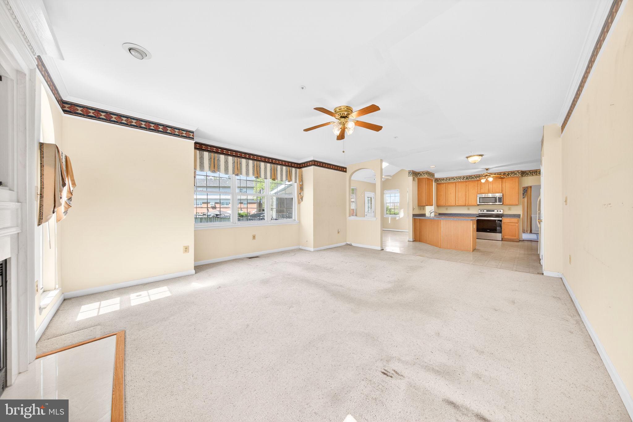 6008 Plata Street Clinton, MD 20735 - Photo 22 of 55 a view of a big room with wooden floor and a window