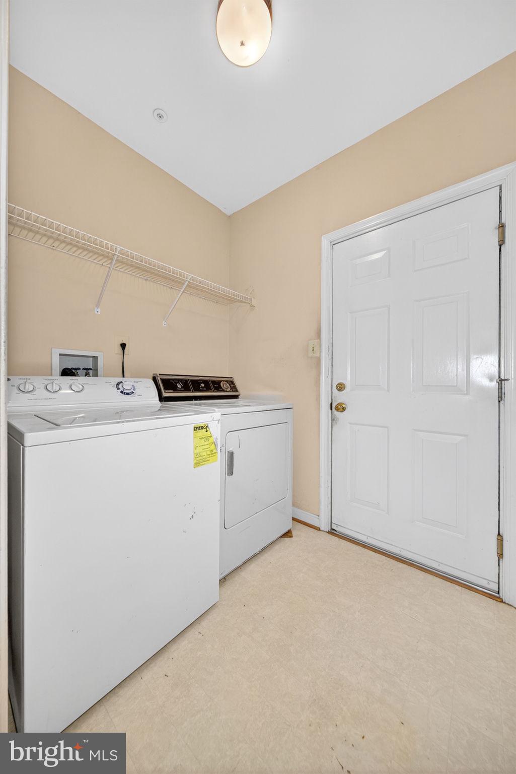 6008 Plata Street Clinton, MD 20735 - Photo 26 of 55 a utility room with dryer and washer