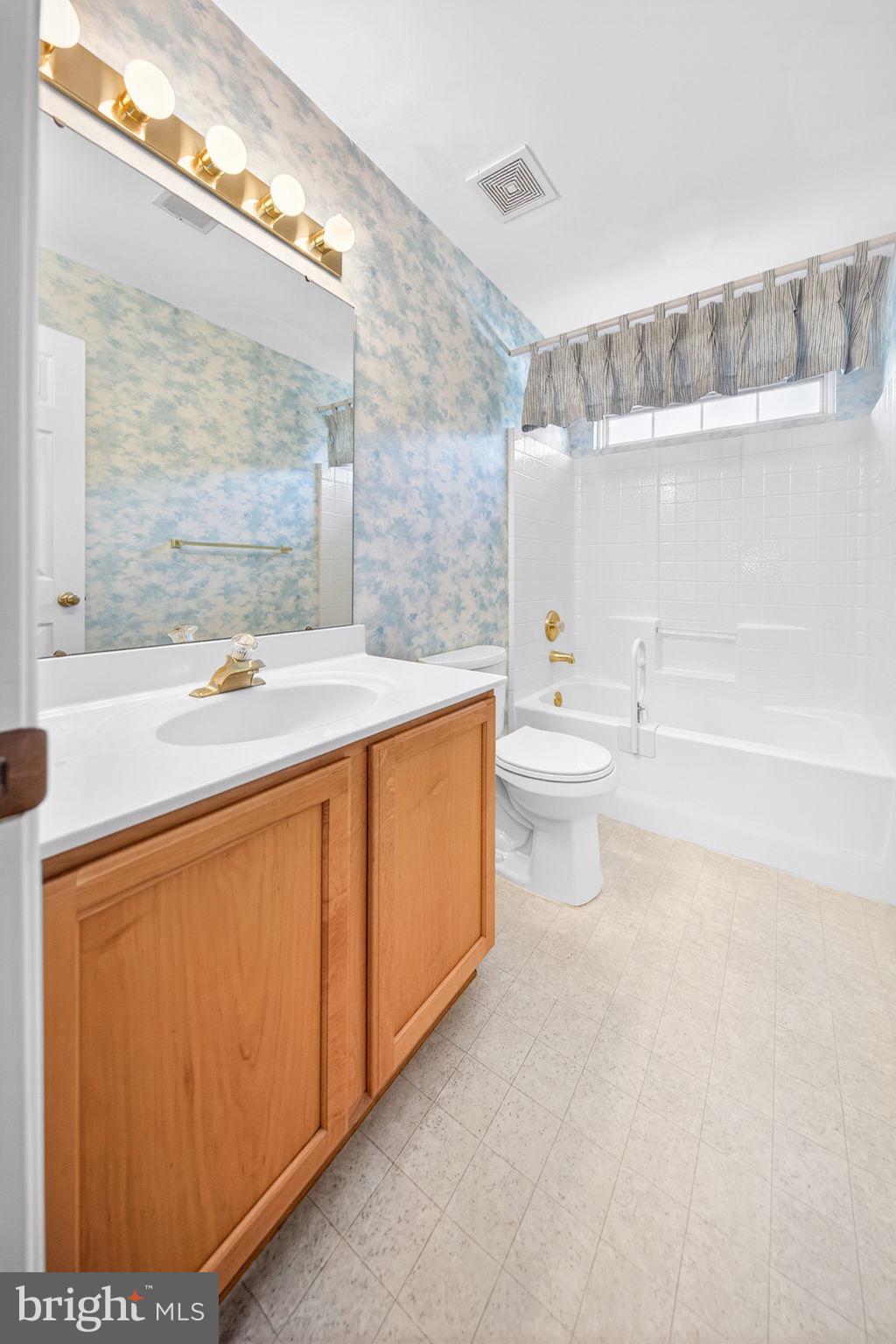 6008 Plata Street Clinton, MD 20735 - Photo 35 of 55 a bathroom with a sink a toilet and shower
