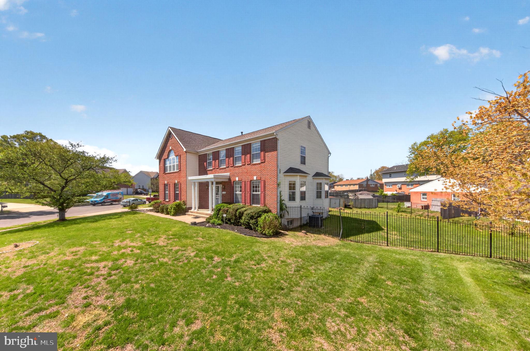 6008 Plata Street Clinton, MD 20735 - Photo 4 of 55 a view of a house with a big yard and sitting area