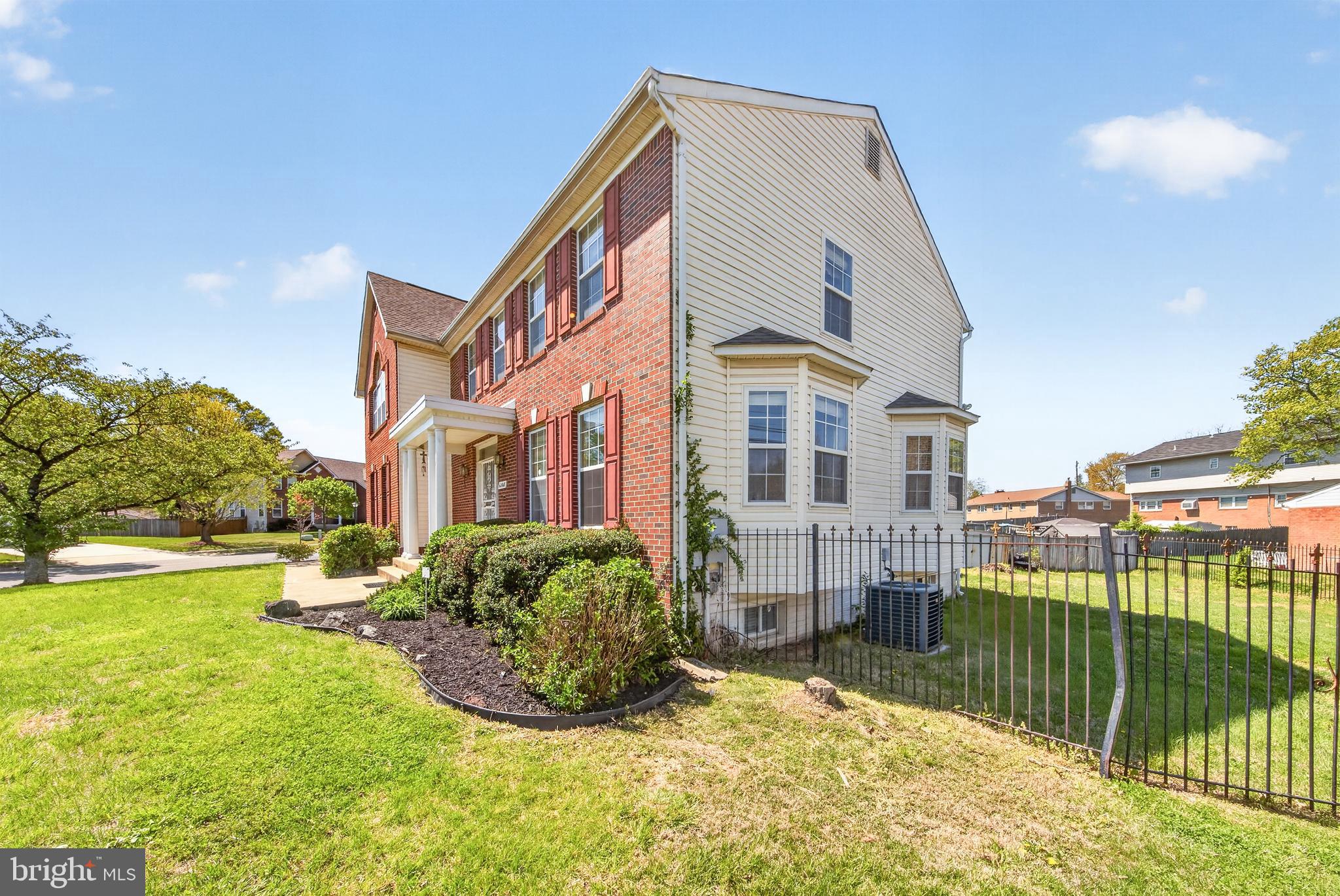 6008 Plata Street Clinton, MD 20735 - Photo 6 of 55 a view of a building with a yard