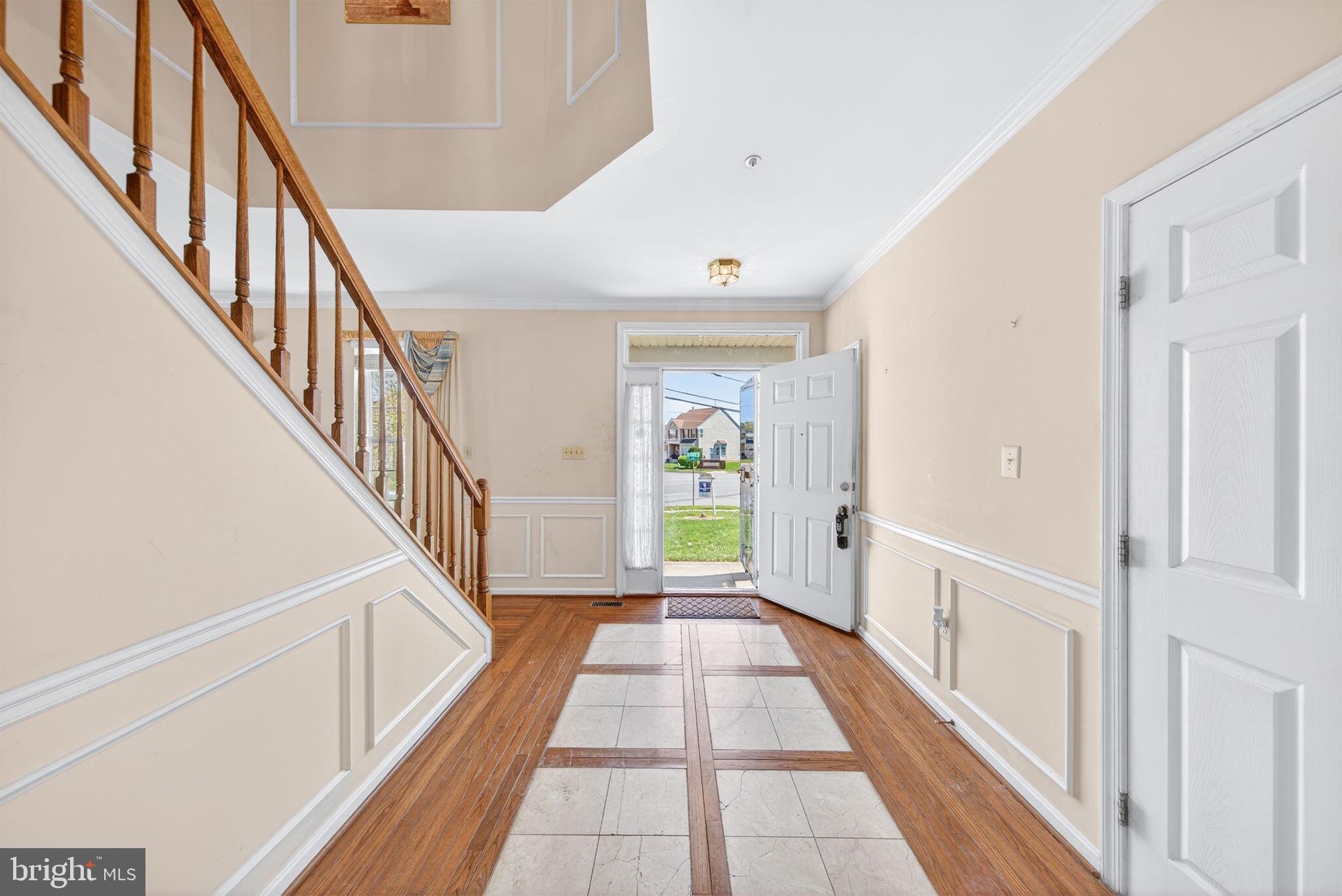 6008 Plata Street Clinton, MD 20735 - Photo 8 of 55 a view of a hallway with wooden floor and staircase