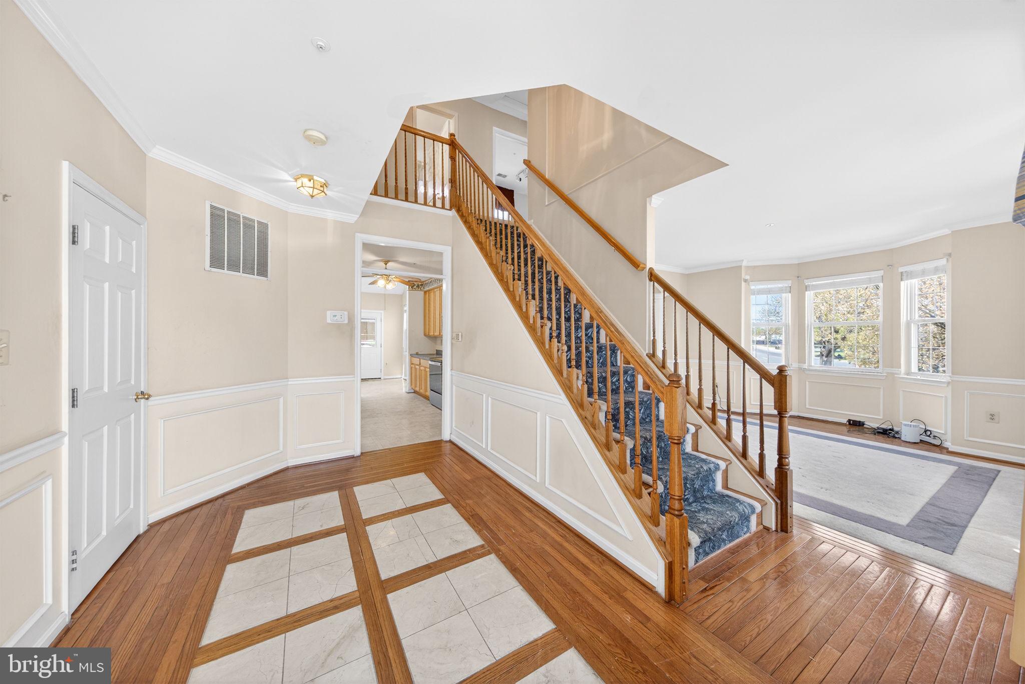 6008 Plata Street Clinton, MD 20735 - Photo 10 of 55 a view of entryway and hall with wooden floor