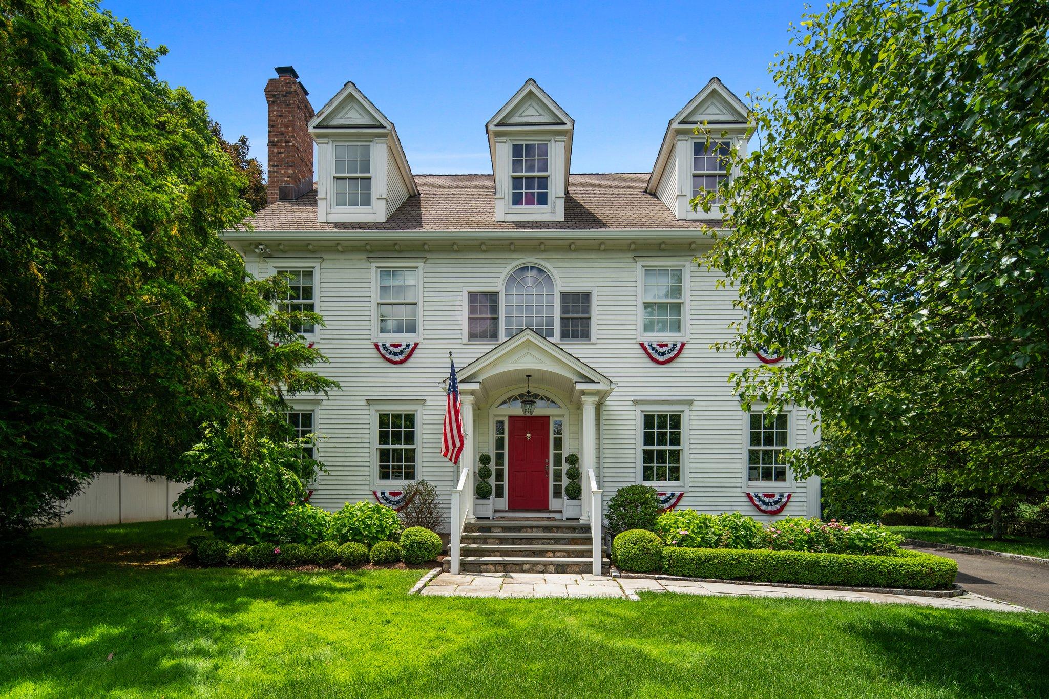 4 Parade Hill Road New Canaan, CT 06840 - Photo 2 of 50 front view of a house with a yard