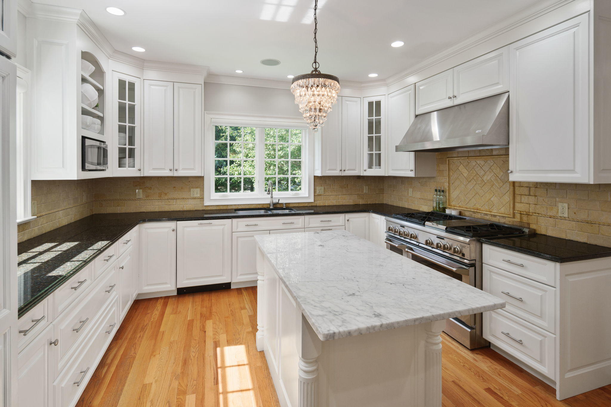 4 Parade Hill Road New Canaan, CT 06840 - Photo 12 of 50 a kitchen with granite countertop a sink a counter space appliances and cabinets