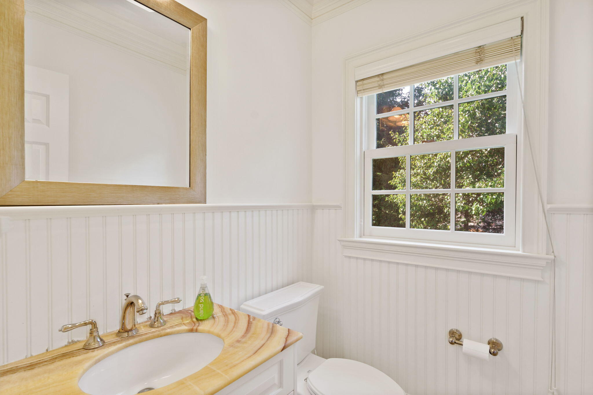 4 Parade Hill Road New Canaan, CT 06840 - Photo 16 of 50 a bathroom with a sink and a mirror