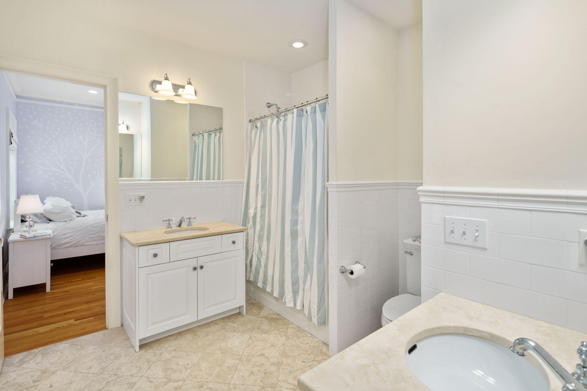 4 Parade Hill Road New Canaan, CT 06840 - Photo 24 of 50 a en suite bathroom with a granite countertop sink and a mirror