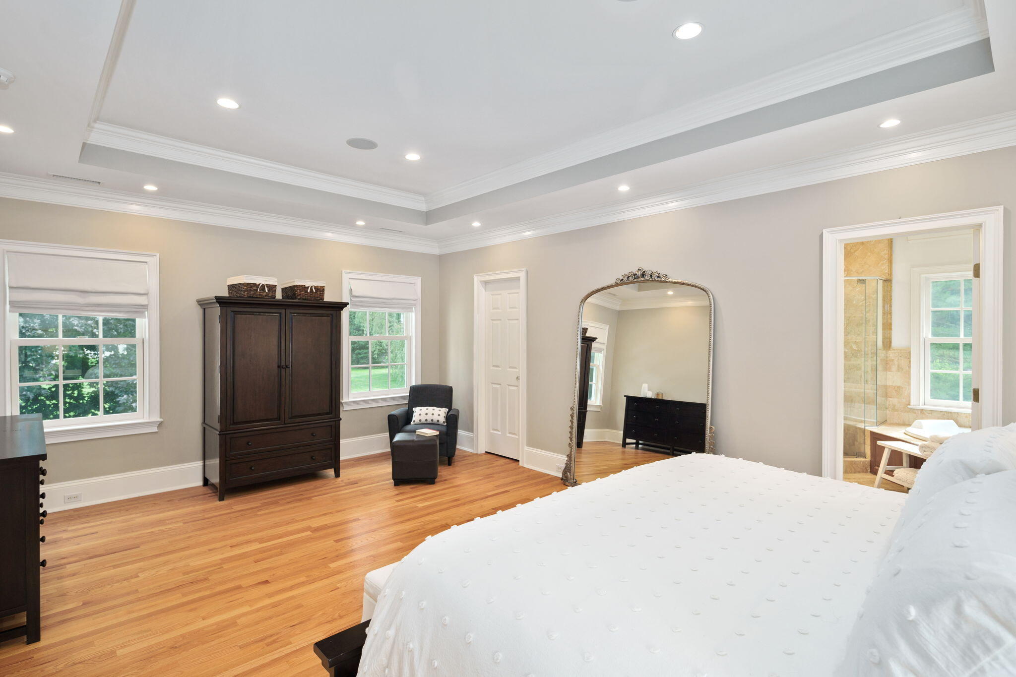 4 Parade Hill Road New Canaan, CT 06840 - Photo 26 of 50 a bedroom with a bed and wooden floor