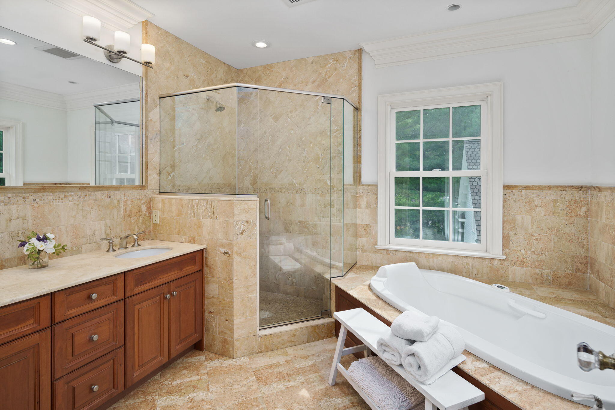 4 Parade Hill Road New Canaan, CT 06840 - Photo 27 of 50 a bathroom with a tub sink and mirror