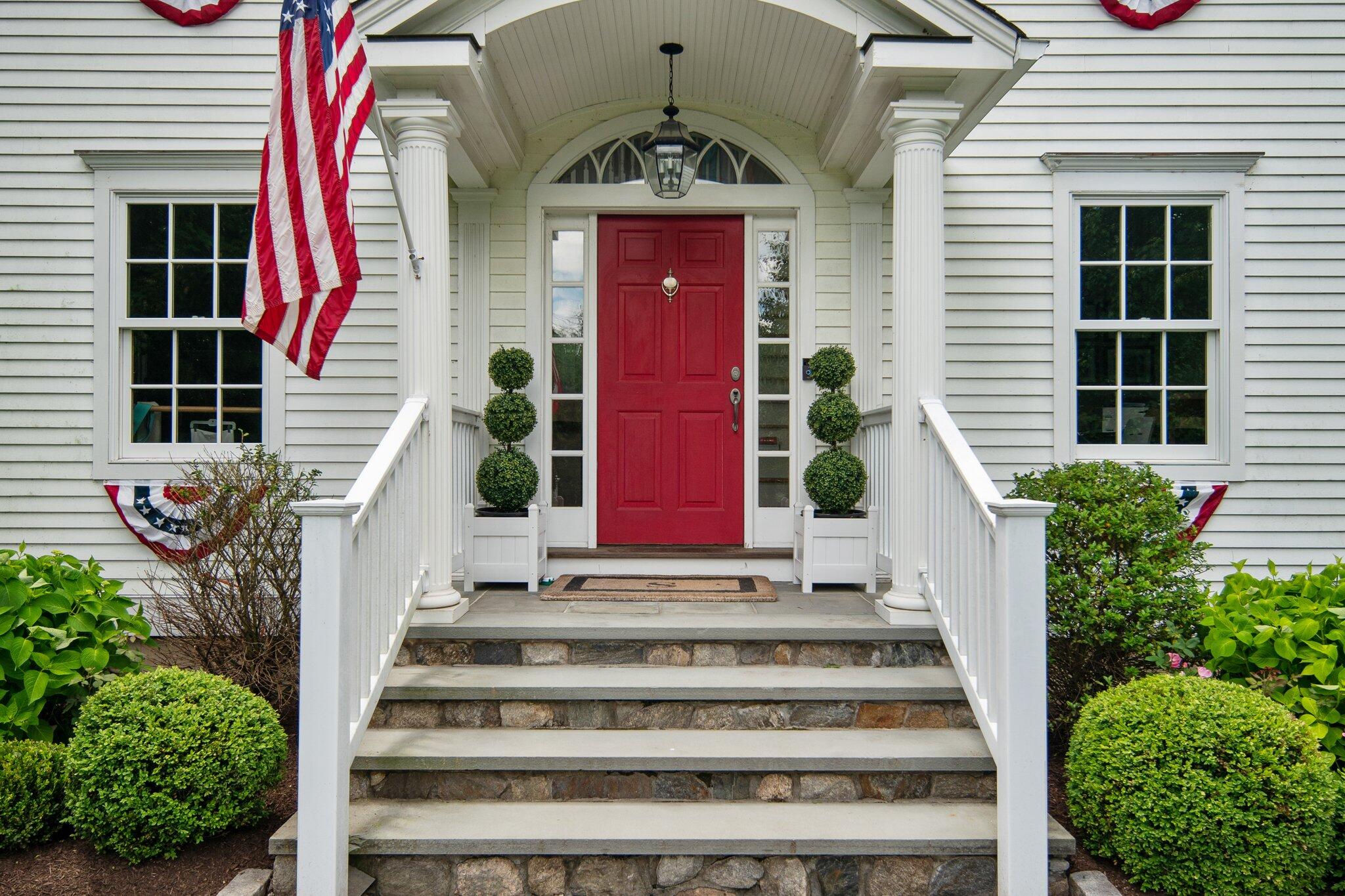 4 Parade Hill Road New Canaan, CT 06840 - Photo 4 of 50 a front view of a house with entryway