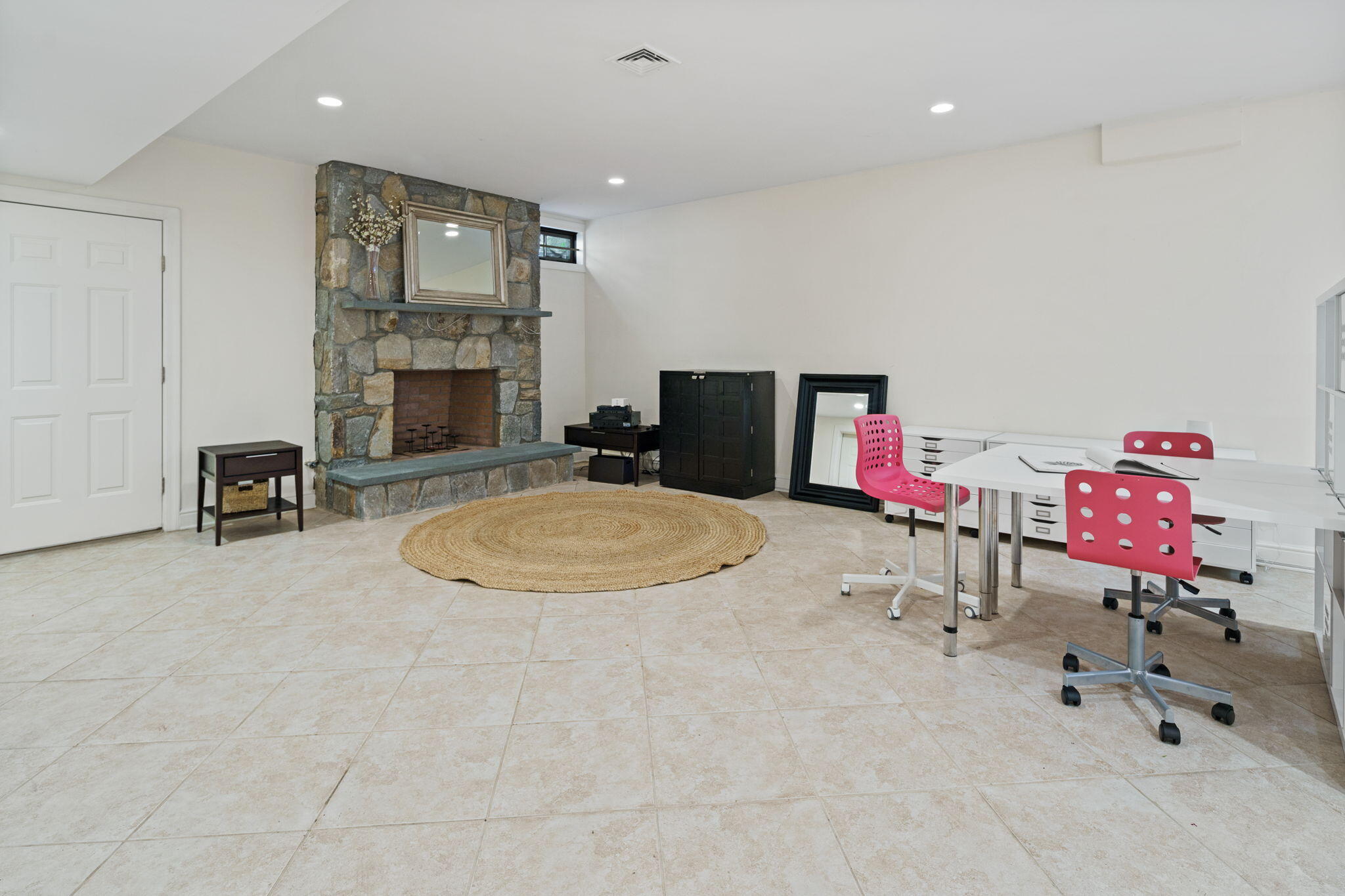 4 Parade Hill Road New Canaan, CT 06840 - Photo 32 of 50 an entryway with a fireplace and cabinet