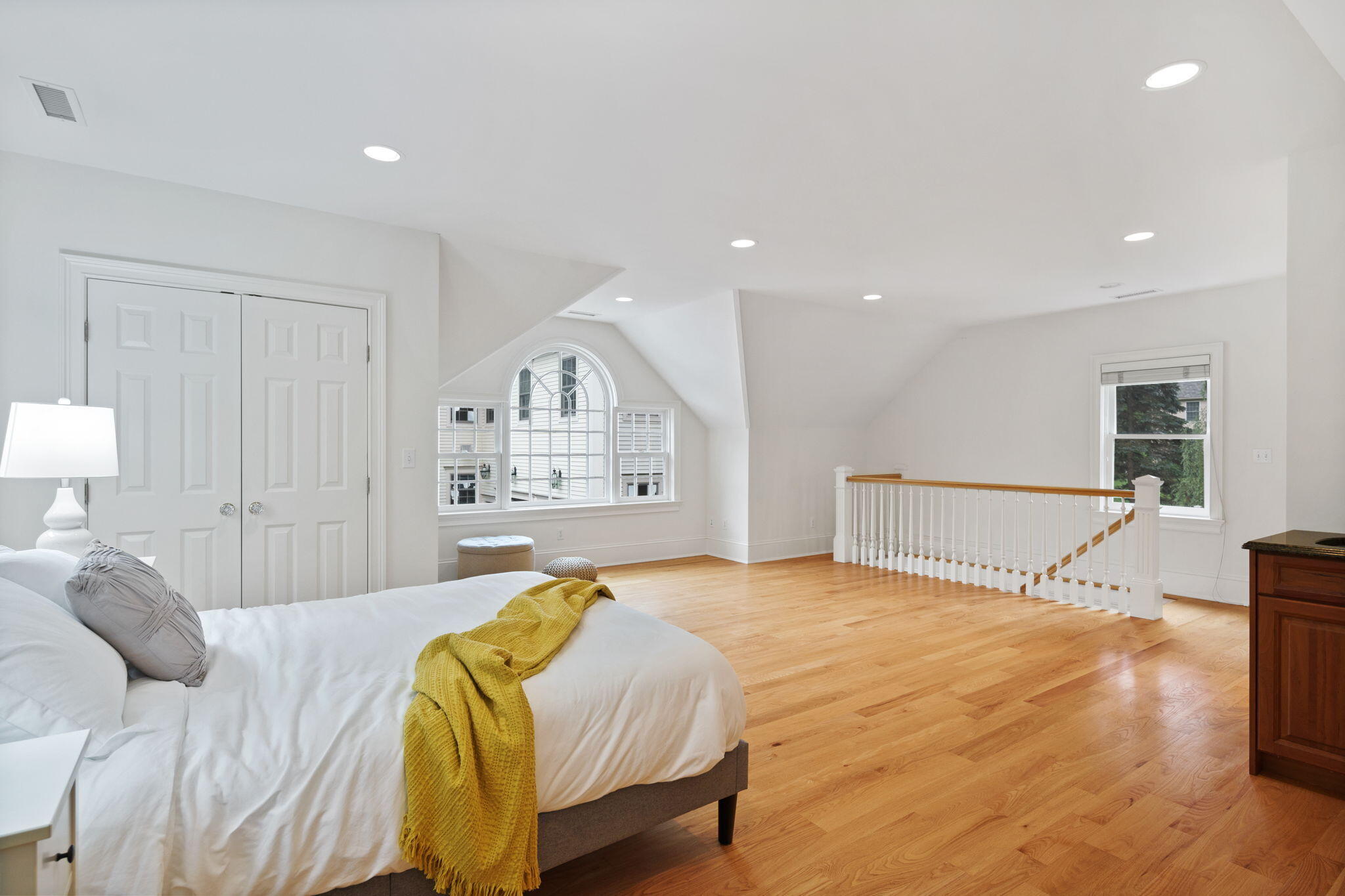 4 Parade Hill Road New Canaan, CT 06840 - Photo 34 of 50 a spacious bedroom with a bed and a lamp