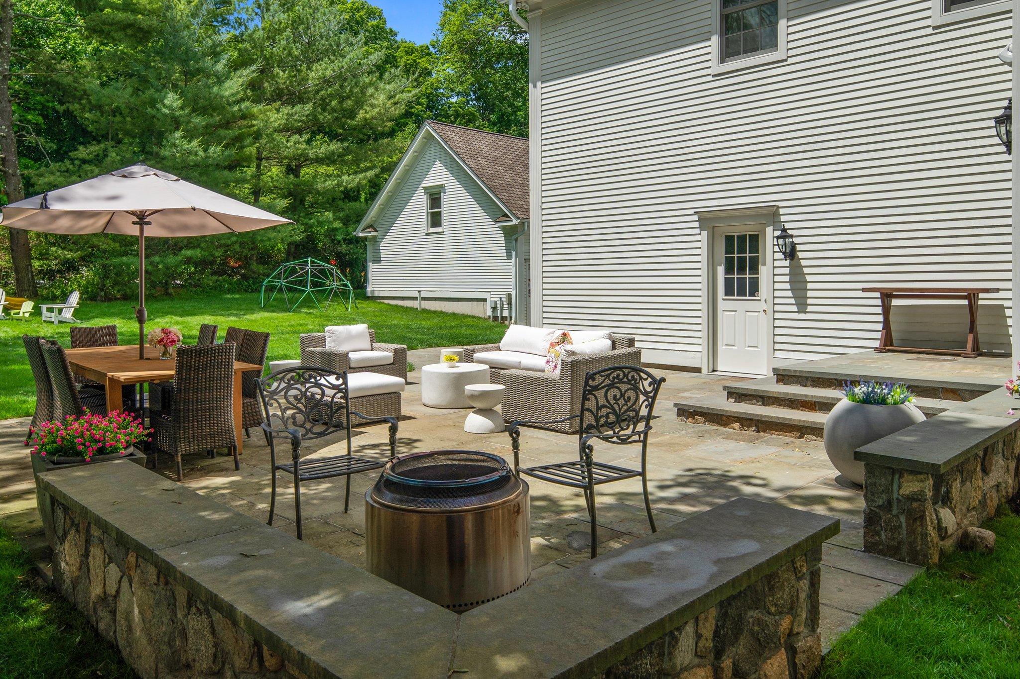 4 Parade Hill Road New Canaan, CT 06840 - Photo 41 of 50 a view of outdoor dining space with a patio and a fire pit