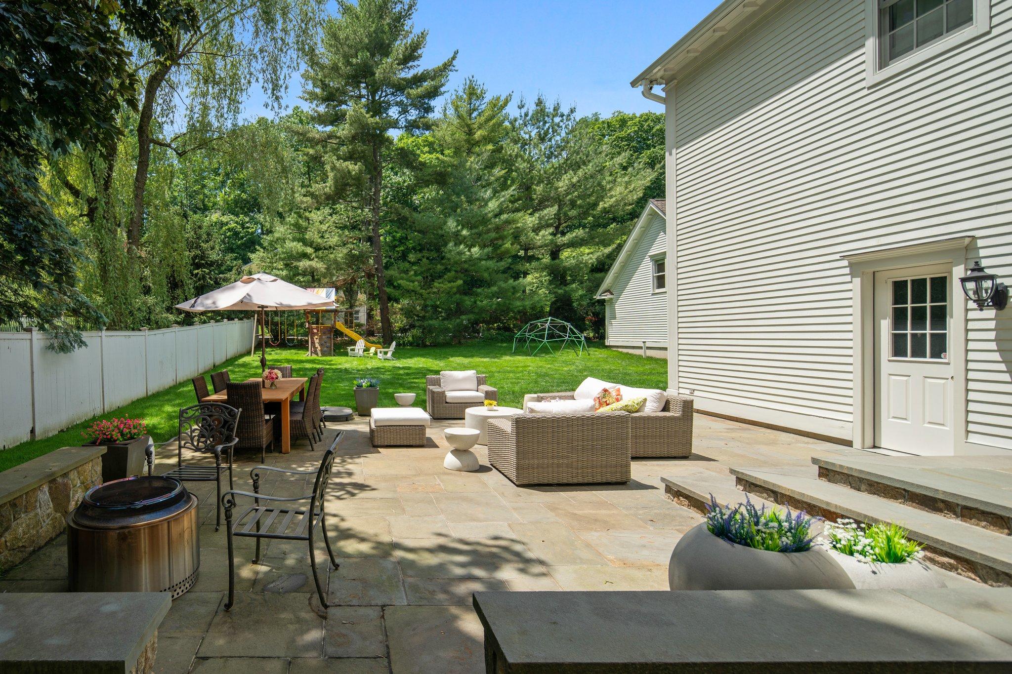 4 Parade Hill Road New Canaan, CT 06840 - Photo 43 of 50 a view of a patio with couches table and chairs and potted plants