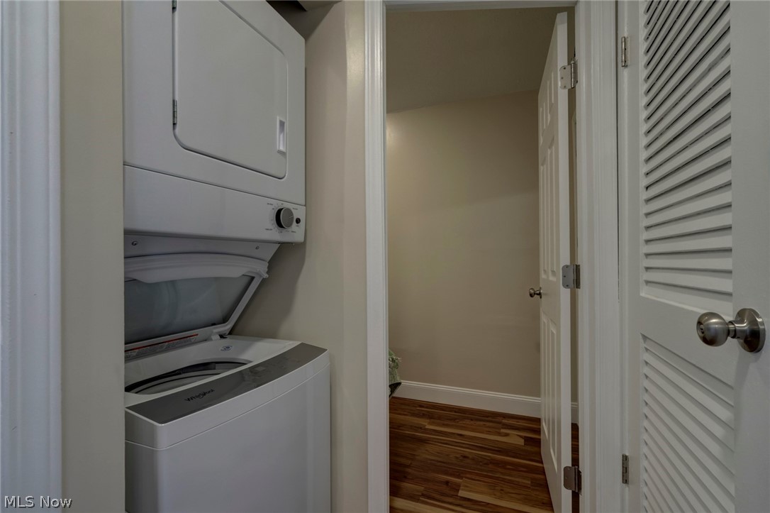189 Harcourt Road Vermilion, OH 44089 - Photo 19 of 36 Laundry area featuring wood finished floors and stacked washer and clothes dryer