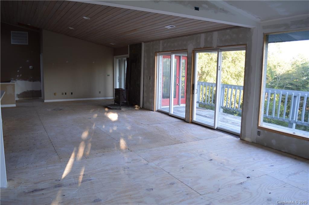 424 Goldfinch Lane Clyde, NC 28721 - Photo 15 of 42 a view of empty room with floor to ceiling window