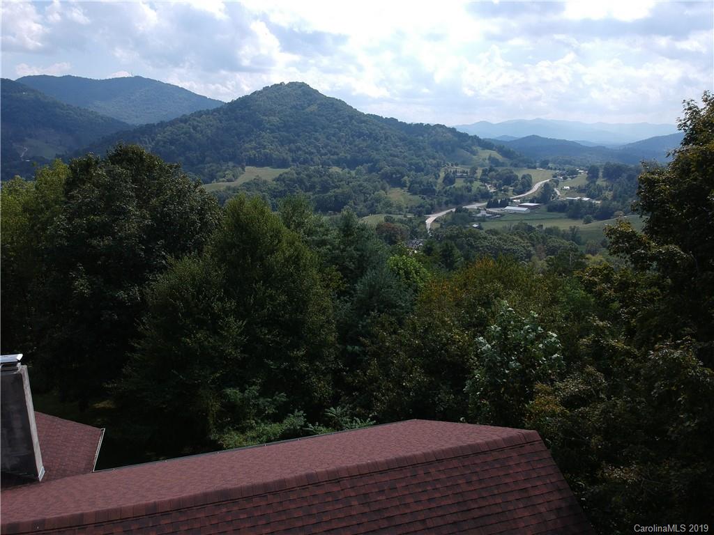 424 Goldfinch Lane Clyde, NC 28721 - Photo 18 of 42 a view of a mountain from a yard