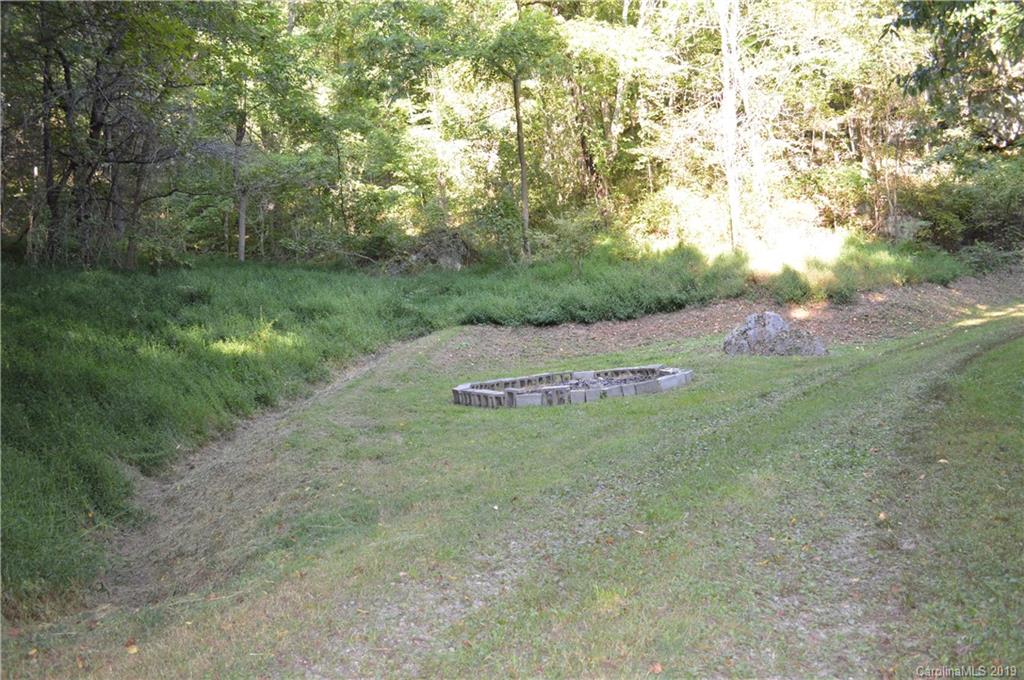 424 Goldfinch Lane Clyde, NC 28721 - Photo 23 of 42 a view of a field with an trees