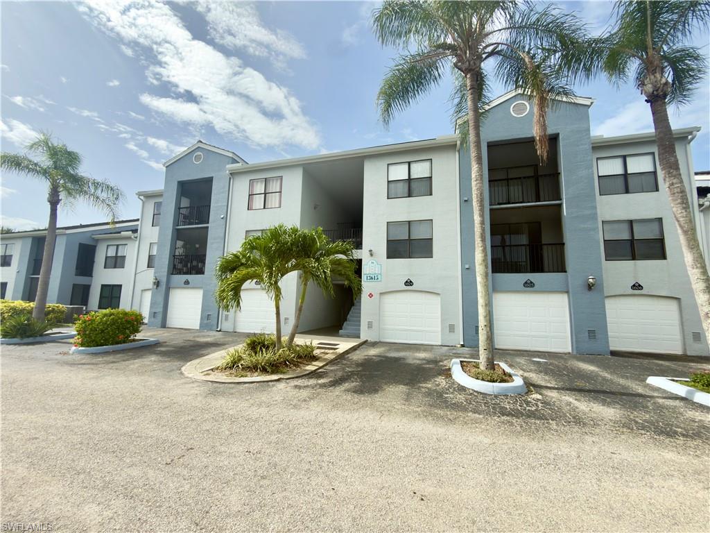 13615 Eagle Ridge Drive, Unit 1614 Fort Myers, FL 33912 - Photo 20 of 34 Swimming pool with integrated steps and metal handrails