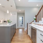 a kitchen with granite countertop a sink and cabinets