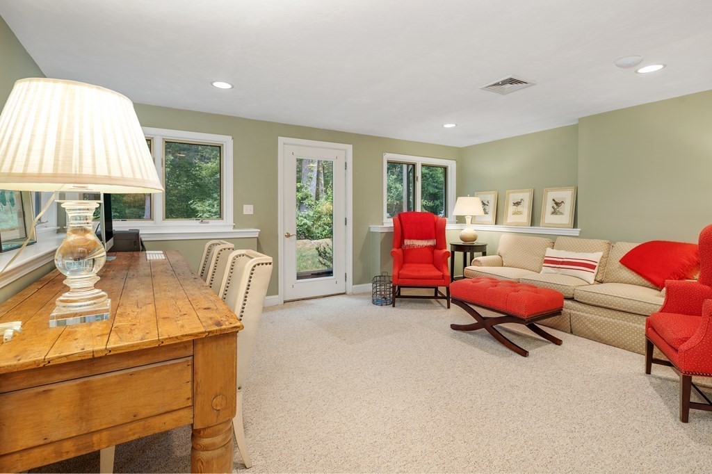 70 Tussock Brook Road, Unit 70 Duxbury, MA 02332 - Photo 12 of 20 a living room with furniture and a large window