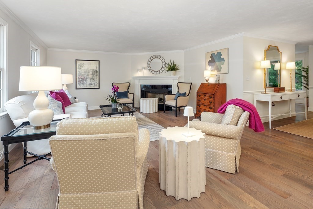 70 Tussock Brook Road, Unit 70 Duxbury, MA 02332 - Photo 4 of 20 a living room with furniture and a chandelier