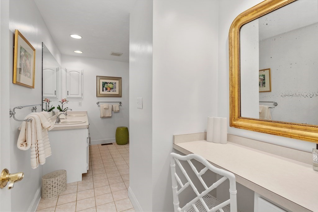 70 Tussock Brook Road, Unit 70 Duxbury, MA 02332 - Photo 9 of 20 a bathroom with a sink a toilet and shower