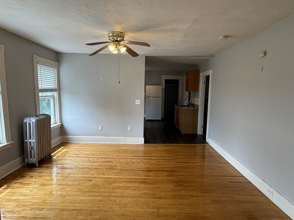 5 Arbor Vitae Street, Unit 2 Worcester, MA 01603 - Photo 6 of 12 a view of a livingroom with a staircase