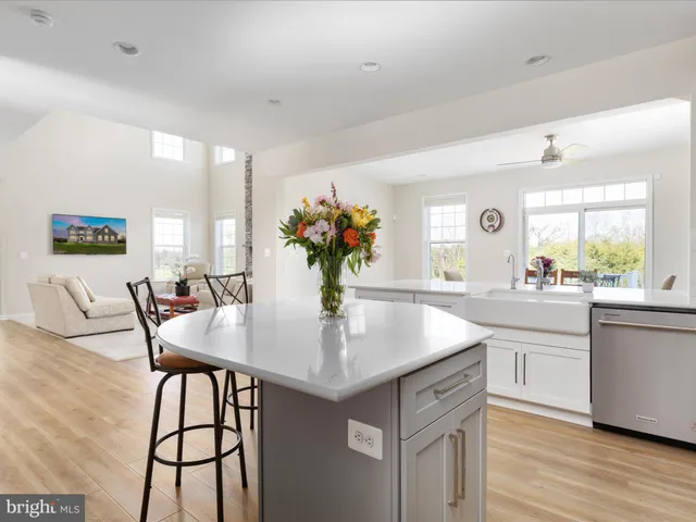 a dining room with a wooden table and chairs