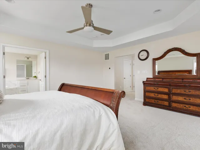 a view of a dining room with furniture and a window