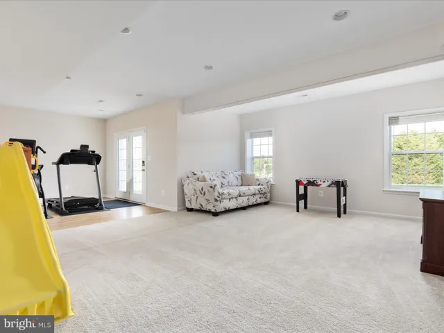 a view of a garden with a wooden fence