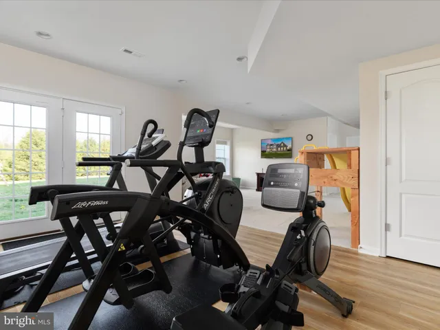 a view of a house with a yard and pathway